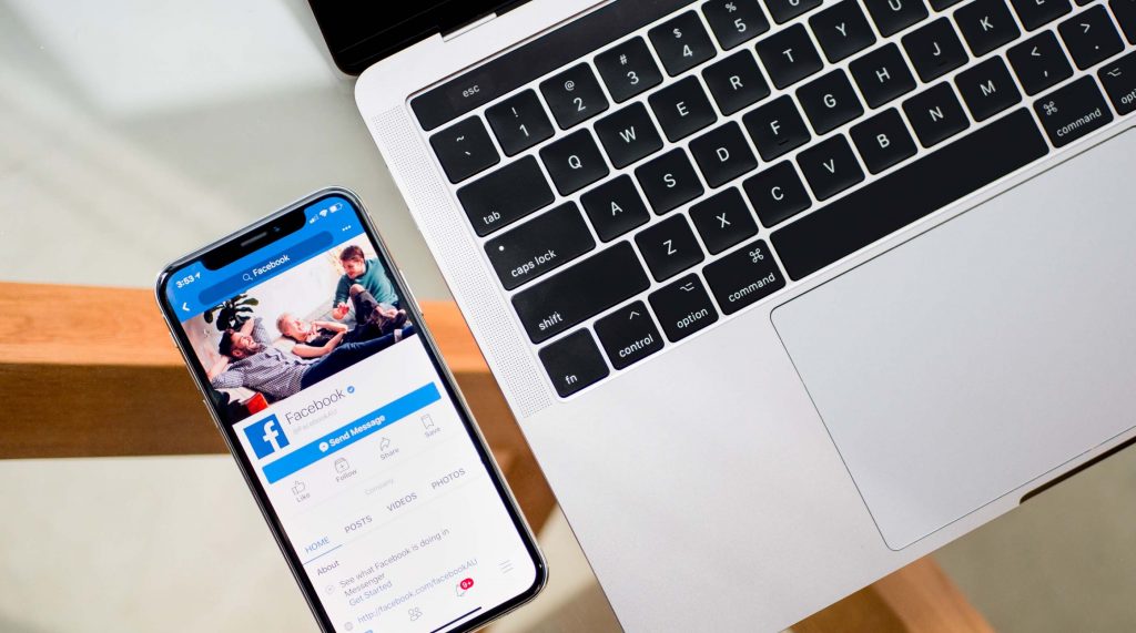 interactive post in a facebook with next to a laptop